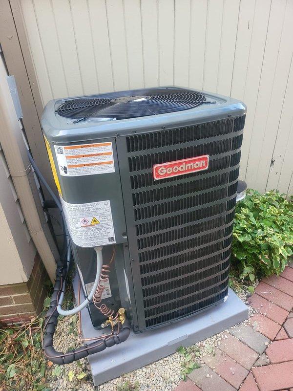 Completed full air conditioning system installation including new Goodman outdoor condenser unit positioned on concrete pad and indoor evaporator coil paired with existing furnace. Installed refrigerant lines with proper insulation, established all necessary electrical connections, and configured condensate drainage system with PVC piping. System was charged with refrigerant, tested for proper operation, and verified to be cooling effectively, resolving the no-cooling condition.