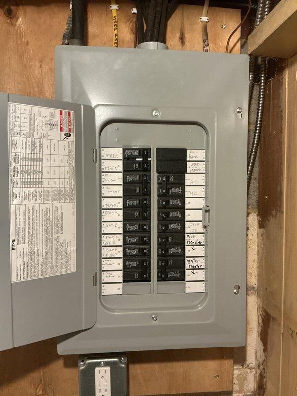 Conducted site assessment for electric vehicle charging station installation. Evaluated existing electrical panel capacity and available breaker spaces in unfinished utility area. Documented current electrical infrastructure including panel configuration, conduit routing, and proximity to proposed charger location. Assessed installation pathway requirements from breaker panel through basement space to determine optimal conduit routing and material needs for EV charger circuit installation.
