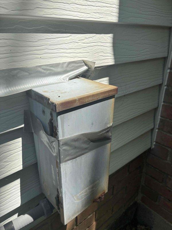 Completed comprehensive cooling season tune-up on residential HVAC system, including inspection of outdoor condensing unit and electrical disconnect box. Performed diagnostic testing with digital multimeter, verifying proper voltage and temperature readings, with system operating within normal parameters at 73.1°F.