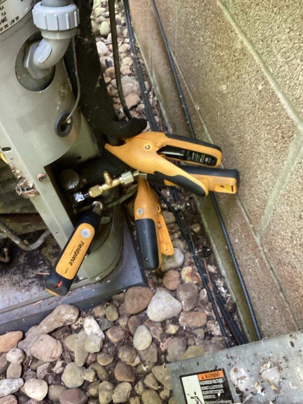 Completed comprehensive cooling system tune-up on outdoor HVAC unit. Performed electrical diagnostics using digital multimeter and clamp meter to verify proper amperage draw and voltage levels across all components. All systems tested within manufacturer specifications and unit operating efficiently.