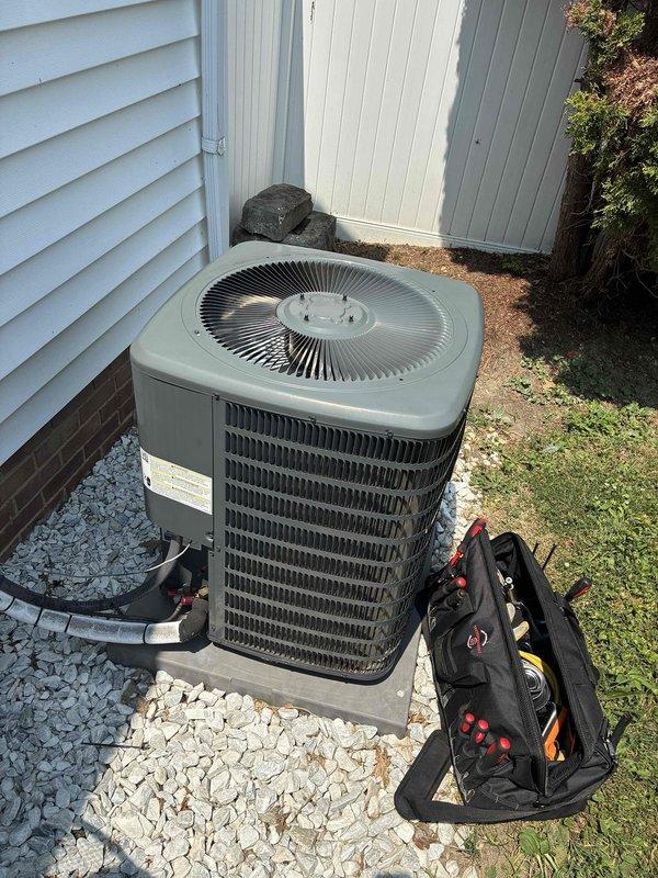 Performed comprehensive tune-up on outdoor air conditioning condenser unit, including visual inspection of all accessible components, verification of electrical connections, and fuse block inspection. Unit operational with fuses in good condition; system ready for continued service.