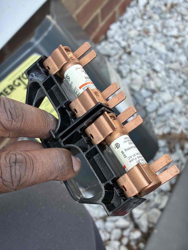 Performed comprehensive tune-up on outdoor air conditioning condenser unit, including visual inspection of all accessible components, verification of electrical connections, and fuse block inspection. Unit operational with fuses in good condition; system ready for continued service.