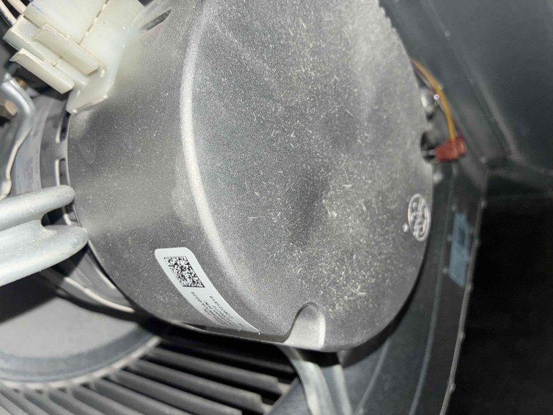 # HVAC Cooling Maintenance Service

Performed comprehensive cooling system maintenance on residential HVAC unit. Conducted thorough inspection of air handler components, including blower motor assembly and control board systems. Observed significant frost accumulation on blower housing, indicating proper cooling operation and adequate refrigerant charge. Verified all electrical connections at terminal blocks were secure, with proper wire routing to LEFT, CENTER, and RIGHT channels on control PCB. Inspected motor rotation settings (BR49-020) and confirmed correct configuration. All LED indicators functioning normally, and control board showed no signs of damage or component failure. System operating within normal parameters for cooling mode.