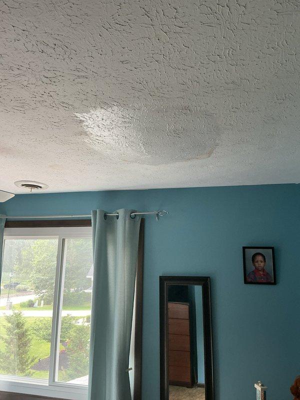 Responded to air conditioning leak complaint. Upon inspection, found evidence of water damage on interior ceiling with visible staining in living area. Accessed attic space and located source of condensate leak from AC system. Inspected drain line routing and evaporator coil area. Cleared clogged condensate drain line and verified proper drainage flow. Tested system operation to confirm leak was resolved and no further water intrusion occurring.