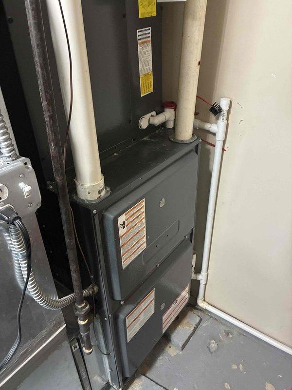 Completed comprehensive AC tune-up on residential furnace system with inspection of blower motor assembly, ventilation components, and PVC intake/exhaust piping. All components found to be in functional condition with normal dust accumulation; system operating within specifications.