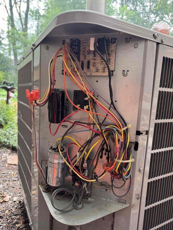 Responded to service call for 18-year-old Carrier air conditioning system running continuously but failing to maintain set temperature during hot weather conditions. Upon arrival, performed diagnostic evaluation of outdoor condensing unit and accessed internal electrical components to inspect capacitors, contactors, and control board connections. System assessment revealed age-related efficiency loss and potential refrigerant concerns. Connected manifold gauges to service ports to evaluate refrigerant charge levels and system pressures. Given the advanced age of the equipment and declining performance characteristics, discussed replacement options with customer as most cost-effective long-term solution versus continued repairs on aging system approaching end of expected service life.