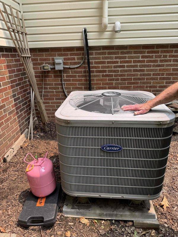 Responded to service call for 18-year-old Carrier air conditioning system running continuously but failing to maintain set temperature during hot weather conditions. Upon arrival, performed diagnostic evaluation of outdoor condensing unit and accessed internal electrical components to inspect capacitors, contactors, and control board connections. System assessment revealed age-related efficiency loss and potential refrigerant concerns. Connected manifold gauges to service ports to evaluate refrigerant charge levels and system pressures. Given the advanced age of the equipment and declining performance characteristics, discussed replacement options with customer as most cost-effective long-term solution versus continued repairs on aging system approaching end of expected service life.