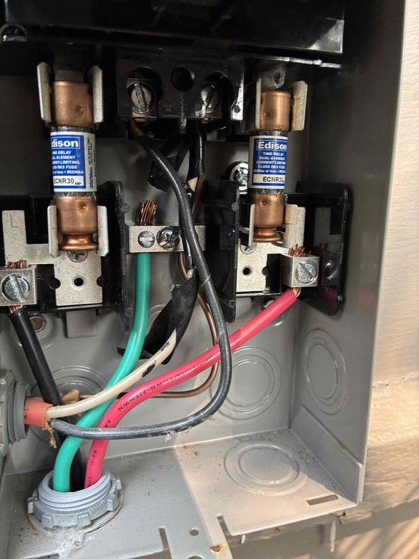 Responded to no-cooling call where thermostat displayed 80°F while set to 77°F and outdoor compressor unit failed to operate after breaker was reset. Upon arrival, performed system diagnostics and verified electrical supply to condensing unit. Inspected disconnect box and fuse assembly, finding compromised fuses preventing power delivery to compressor. Replaced failed Edison-type fuses in outdoor disconnect, restored proper electrical connection, and verified system operation. Unit returned to normal cooling cycle with compressor engaging properly.