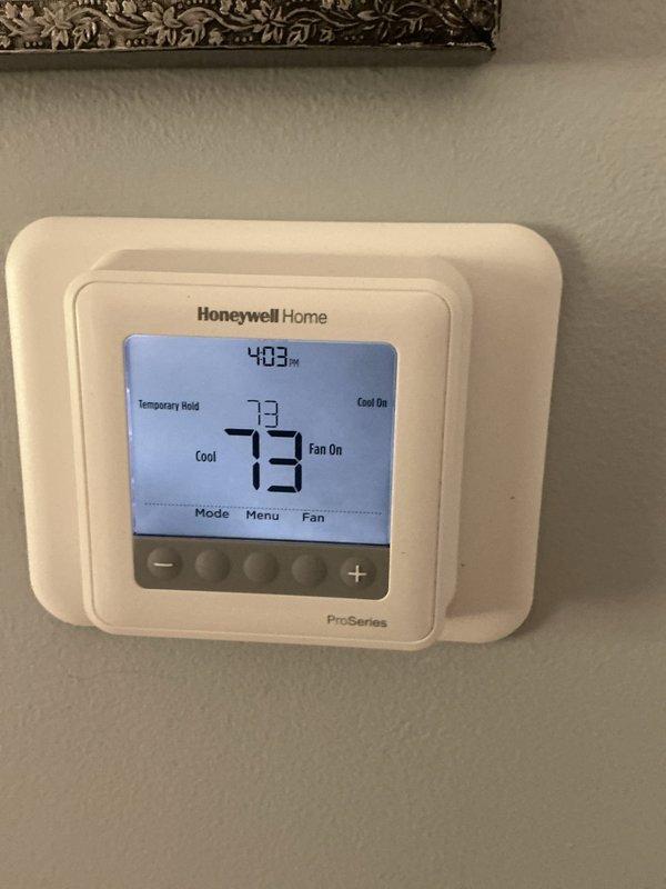 Responded to complaint of insufficient cooling and reduced airflow. Upon inspection, found thermostat functioning properly and displaying 73°F with system in cooling mode. Replaced AprilAire 413 (16x25x4) air filter to restore proper airflow and system efficiency.