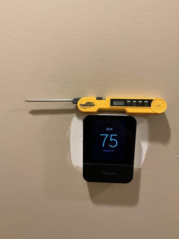 Responded to service call for newly installed air conditioning system experiencing thermostat inconsistency issues, with indoor temperature varying 8 degrees above or below setpoint. Upon arrival, verified thermostat displaying 75°F while actively cooling to 73°F setpoint. Used calibrated digital thermometer to measure actual room temperature and confirm temperature differential. Inspected control board wiring and connections inside air handler unit, checking all thermostat wire terminations including R, C, Y, G, W, and accessory wires for proper seating and continuity. Verified control board functionality and reviewed system configuration settings to ensure proper communication between thermostat and equipment. Addressed temperature sensing and system cycling concerns to restore accurate climate control operation.