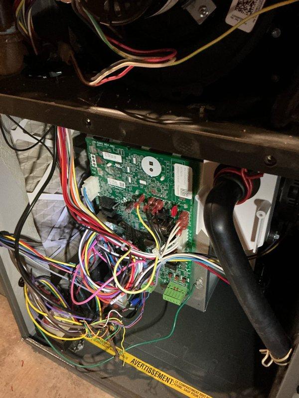 Responded to service call for newly installed air conditioning system experiencing thermostat inconsistency issues, with indoor temperature varying 8 degrees above or below setpoint. Upon arrival, verified thermostat displaying 75°F while actively cooling to 73°F setpoint. Used calibrated digital thermometer to measure actual room temperature and confirm temperature differential. Inspected control board wiring and connections inside air handler unit, checking all thermostat wire terminations including R, C, Y, G, W, and accessory wires for proper seating and continuity. Verified control board functionality and reviewed system configuration settings to ensure proper communication between thermostat and equipment. Addressed temperature sensing and system cycling concerns to restore accurate climate control operation.