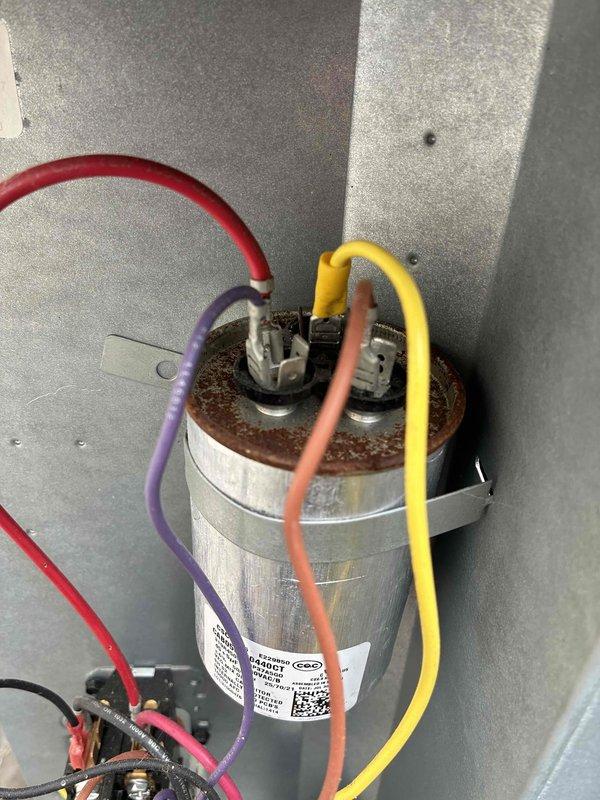 Completed comprehensive cooling system tune-up on residential HVAC unit. Performed diagnostic testing using clamp meter to verify electrical readings and system performance. Inspected capacitor, noting corrosion on terminals, and verified all wire connections for proper operation.