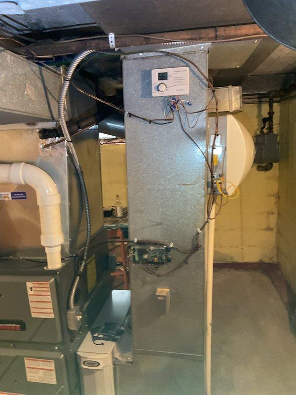 Performed comprehensive cooling maintenance on residential HVAC system located in basement utility area. Inspected air handler unit, verified proper operation of all components, checked refrigerant levels, cleaned condensate drain lines, and tested system controls to ensure optimal cooling performance for the season.