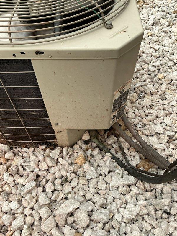 Conducted on-site evaluation of existing HVAC system to assess cooling capacity concerns and provide replacement options. Inspected indoor air handler unit located in attic space, including blower assembly, filter housing, and condensate drain configuration. Evaluated outdoor condensing unit condition, noting weathered exterior casing and examining condenser coil fins for debris accumulation and operational wear. Documented current equipment specifications from manufacturer data plate for proper sizing calculations. Photographed existing system components to support replacement recommendations addressing undersized equipment concerns. Provided customer with multiple equipment options for system replacement to achieve adequate cooling capacity for the residence.