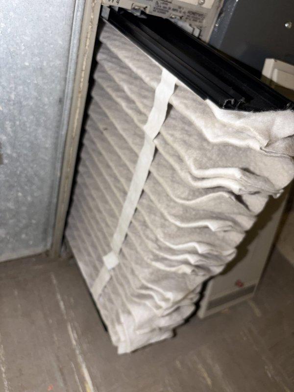 Completed routine HVAC cooling maintenance inspection, including examination of the air filtration system with pleated accordion-style filter showing normal wear and operational condition. Verified supply air temperature at 68.0°F using calibrated digital thermometer, confirming proper system performance and cooling output within acceptable parameters.