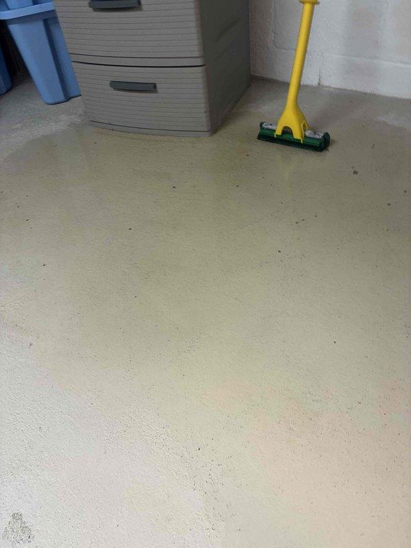 Responded to callback for recurring water leak in utility room from air conditioning system. Previous service visit on 7/10 had addressed initial water leak, but large amounts of water were again accumulating on the floor. Performed visual inspection of the affected area and documented conditions with photographs showing the utility room layout, electrical panel, and flooring where water accumulation was occurring. Further diagnostics required to identify root cause of persistent condensate drainage issue.