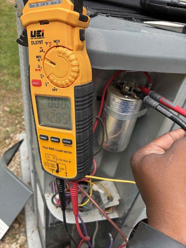 Completed preventive maintenance on residential cooling system. Performed comprehensive system inspection including temperature diagnostics at supply duct, recording 41.98°F discharge air temperature indicating proper cooling performance. Tested capacitor functionality using digital multimeter to verify electrical integrity and proper microfarad readings. Inspected refrigerant lines, ductwork, and all accessible components. System operating within normal parameters with no deficiencies noted.