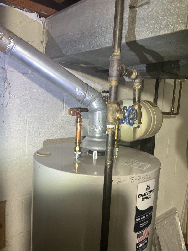 Conducted comprehensive on-site evaluation for electrical panel replacement in residential basement utility area. Assessed existing electrical service configuration, documented current panel condition, and identified necessary upgrades to meet current electrical code requirements. Evaluated available working space around existing panel location, confirmed adequate clearance for new panel installation, and verified compatibility with existing service entrance conductors. Photographed utility room layout to document proximity of water heater, pressure tank, and plumbing infrastructure for coordination during panel replacement work. Determined scope of work including new circuit breaker panel, grounding requirements, and any necessary service entrance modifications to ensure safe and compliant electrical system upgrade.