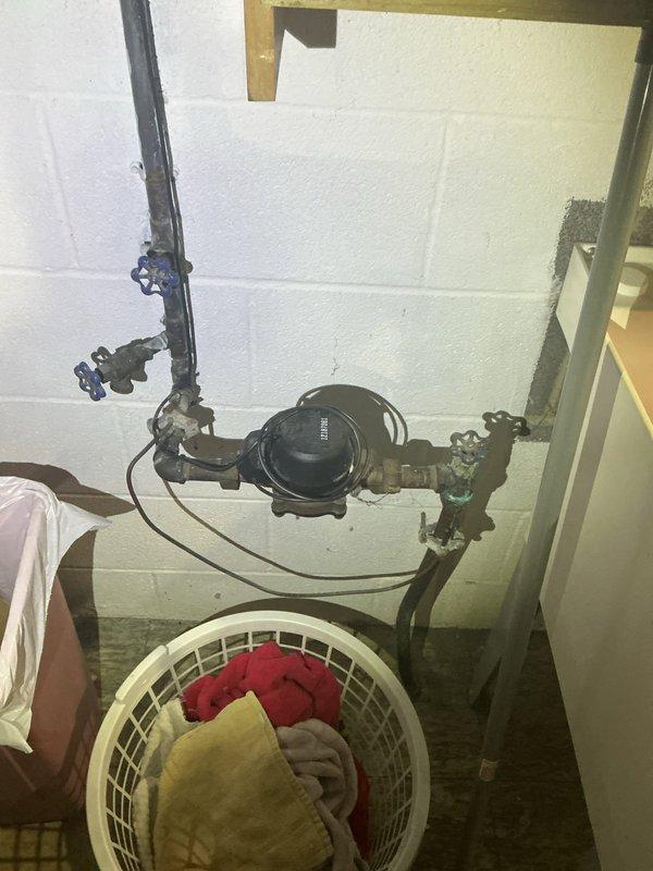 Conducted comprehensive on-site evaluation for electrical panel replacement in residential basement utility area. Assessed existing electrical service configuration, documented current panel condition, and identified necessary upgrades to meet current electrical code requirements. Evaluated available working space around existing panel location, confirmed adequate clearance for new panel installation, and verified compatibility with existing service entrance conductors. Photographed utility room layout to document proximity of water heater, pressure tank, and plumbing infrastructure for coordination during panel replacement work. Determined scope of work including new circuit breaker panel, grounding requirements, and any necessary service entrance modifications to ensure safe and compliant electrical system upgrade.