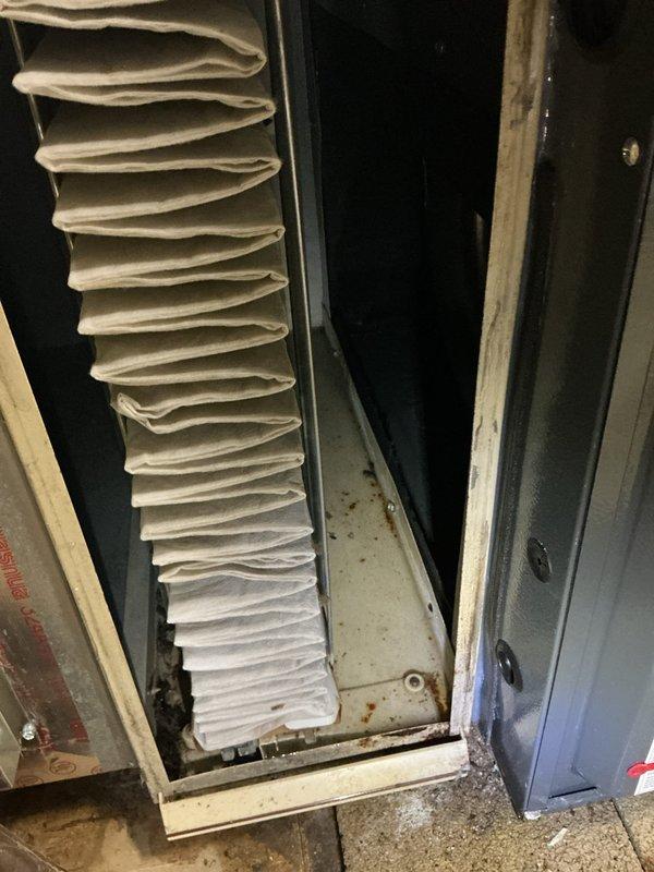 Responded to customer concern regarding water leakage in basement near condensation pump. Upon inspection, verified furnace operation and examined air filtration system, noting dust accumulation in filter compartment. Inspected HVAC unit installation including copper refrigerant lines, PVC condensate drainage system, and electrical connections to identify source of reported leak and ensure proper system function.