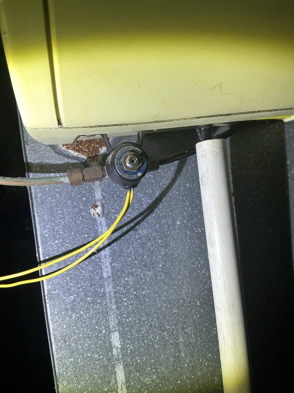 Responded to water leak in basement originating from furnace area as confirmed by city department inspection. Upon arrival, inspected copper piping, tubing connections, and valve fittings in the mechanical space. Observed aging copper components with visible patina, mineral deposits, and corrosion on brass fittings. Examined condensate drainage system and plumbing connections beneath furnace unit, including PVC drain line and associated copper tubing. Documented conditions of all piping infrastructure and connection points for assessment and future reference.