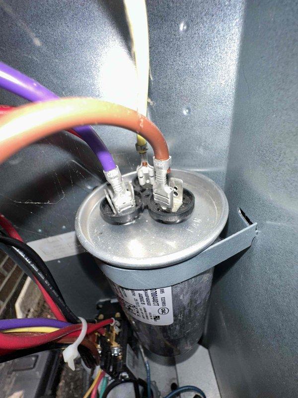 Completed routine cooling maintenance on HVAC system, including inspection and cleaning of air filter assembly and verification of capacitor connections and electrical components. All components were found in good working condition with secure wiring connections, and the system is operating within normal parameters.