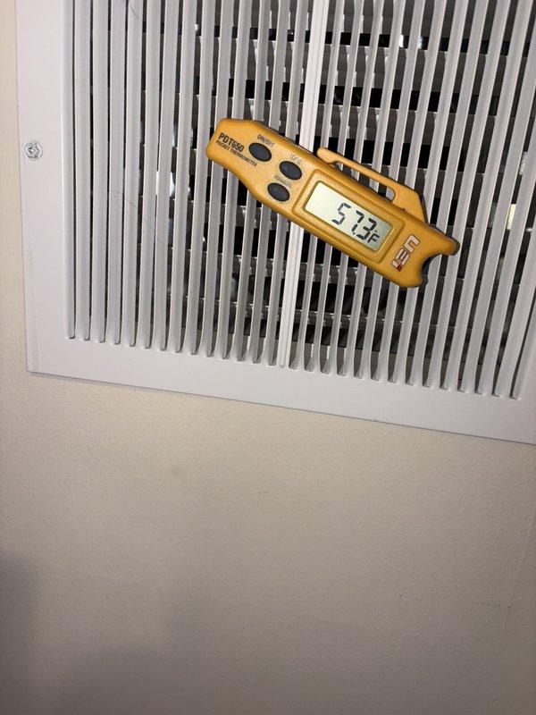 Completed comprehensive cooling system tune-up and performance evaluation. Conducted temperature differential measurements at supply registers, recording 57.3°F output, and performed moisture readings at window areas to assess indoor humidity levels and overall system efficiency. All components inspected and system operating within normal parameters.