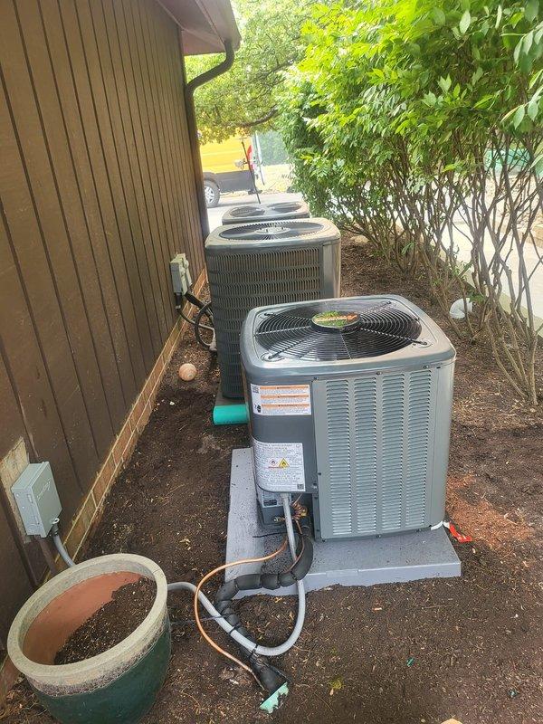 Completed installation of new air conditioning system and dehumidifier unit at residential property. System commissioning included refrigerant charging verification, electrical connections, and airflow testing to ensure optimal performance. All equipment installed to manufacturer specifications with proper drainage and condensate management configured for the multi-unit HVAC setup in the side yard location.