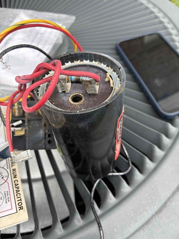 Performed diagnostic testing on outdoor A/C unit and replaced failed run capacitor. Used digital multimeter to verify electrical readings and confirm proper system operation after component replacement.