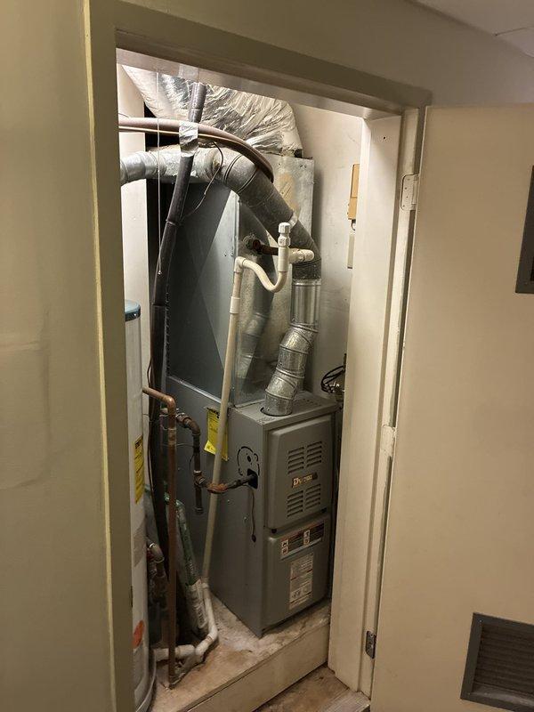 Conducted on-site assessment of existing HVAC system to provide replacement estimate for cooling equipment, with customer requesting options for both complete heating and cooling system replacement as well as cooling-only replacement. Inspected attic-mounted air handler unit, associated ductwork including flexible and rigid metallic supply ducts, refrigerant lines, and electrical connections. Evaluated basement mechanical room containing furnace unit, water heater, existing ductwork distribution system, and associated plumbing infrastructure. Documented current equipment configuration, ductwork layout, and installation conditions through comprehensive photography to develop accurate replacement proposals addressing customer's cooling system priorities.