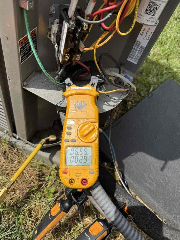 # HVAC Cooling Maintenance Completed

Performed comprehensive preventive maintenance on residential air conditioning system as part of scheduled recurring service program. Conducted electrical diagnostics at outdoor condenser unit using digital multimeter to verify proper voltage and amperage readings across all electrical components and terminal connections. Inspected all wire connections within electrical panel compartment, confirming secure terminations and proper conductor routing.

Evaluated refrigerant system performance using manifold gauge set to measure operating pressures. Assessed system charge levels and verified refrigerant lines were properly secured and insulated. Monitored supply air temperature at interior vent register using digital thermometer to confirm adequate cooling output and proper system operation. All temperature differentials measured within manufacturer specifications, indicating optimal heat transfer and system efficiency.

Inspected outdoor unit mounting