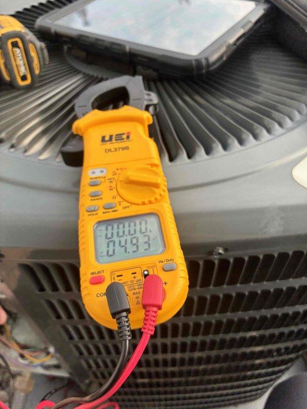 Completed routine cooling system maintenance on residential HVAC unit. Performed electrical diagnostics on condenser unit using digital multimeter to verify proper voltage and amperage readings, inspected condenser coil condition and fin integrity, and examined blower motor assembly including electrical connections and wiring harness for secure operation. All components found operating within normal parameters with no deficiencies noted.