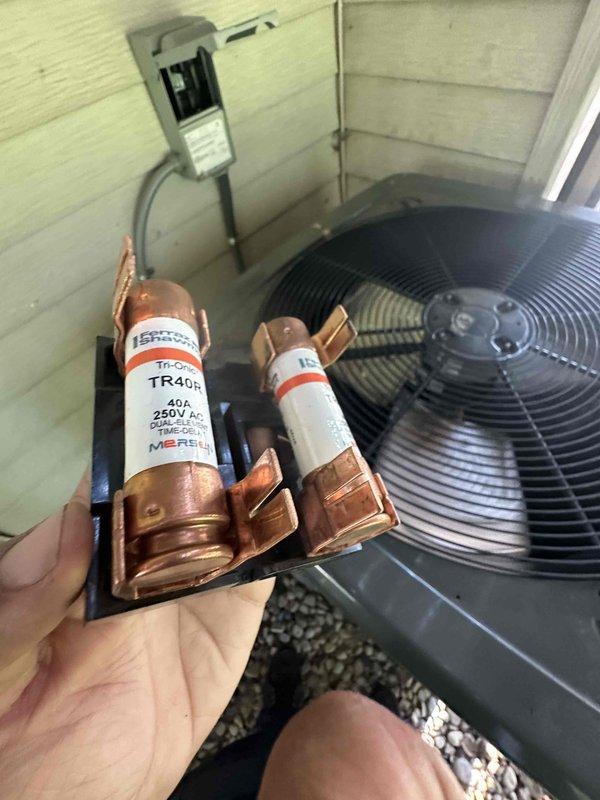 Performed routine cooling maintenance on residential HVAC system. Inspected and documented electrical components including 40A 250V TR406 fuses in disconnect, verified capacitor condition, and checked wiring connections within condensing unit. All components found in operational condition with system running properly upon completion.