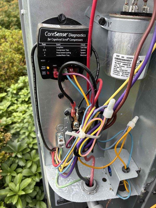 Completed scheduled preventive maintenance on residential cooling system equipped with Copeland scroll compressor. Performed comprehensive inspection of outdoor condensing unit, verifying proper operation of CoreSense diagnostic module with no active fault codes or alarm conditions present. Confirmed condenser coil cleanliness, checked refrigerant line connections at service ports, verified capacitor mounting and electrical connections secure, and documented system operating within normal parameters.