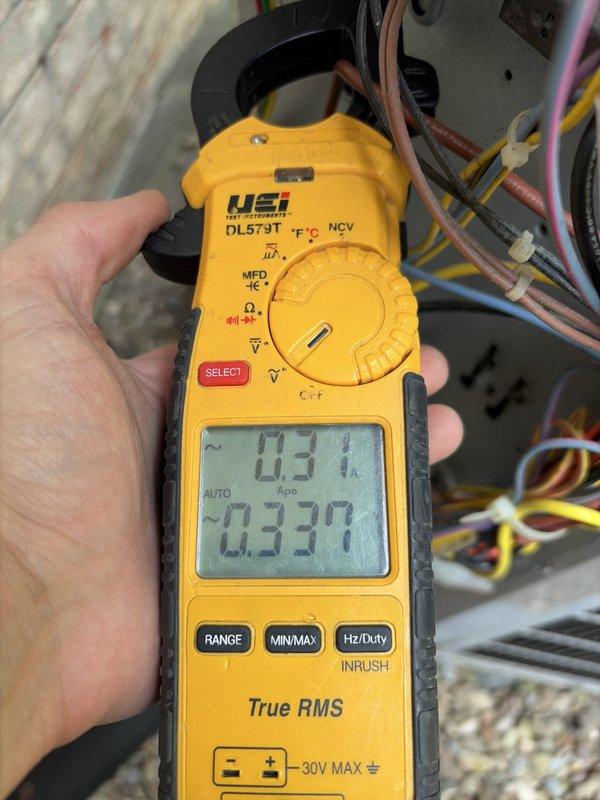 Performed routine cooling maintenance on residential HVAC system. Conducted electrical diagnostics using digital clamp meter, recording voltage and amperage readings to verify proper system operation. All components functioning within normal parameters, with system showing 113.1V and 0.330A readings at time of inspection. Completed visual inspection of furnace unit, ductwork connections, and associated electrical components to ensure safe and efficient operation for the cooling season.