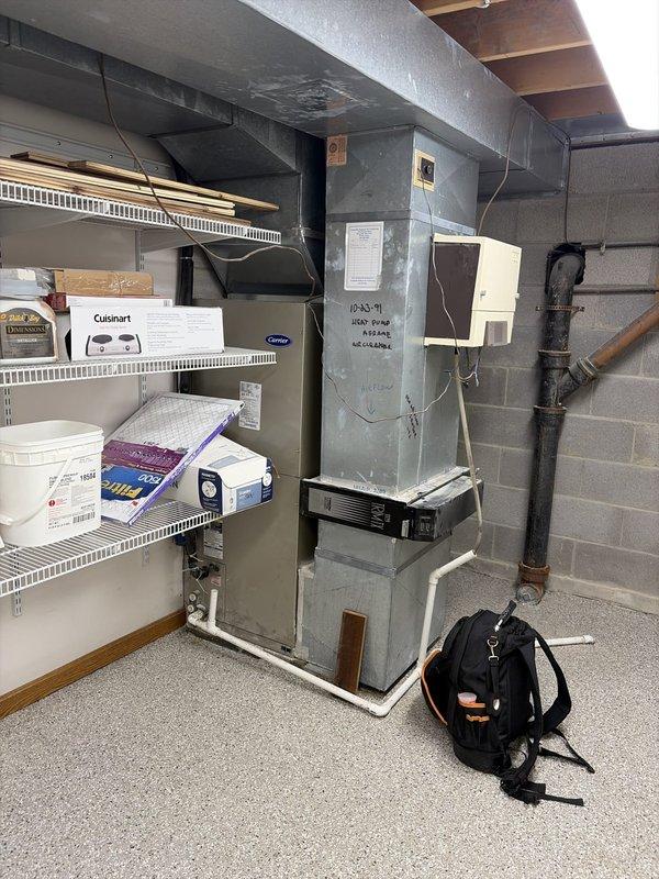 Performed routine cooling maintenance on residential HVAC system. Conducted electrical diagnostics using digital clamp meter, recording voltage and amperage readings to verify proper system operation. All components functioning within normal parameters, with system showing 113.1V and 0.330A readings at time of inspection. Completed visual inspection of furnace unit, ductwork connections, and associated electrical components to ensure safe and efficient operation for the cooling season.