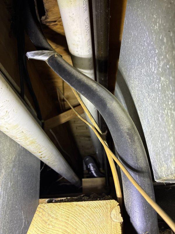 Responded to a no-cool complaint on a 16-year-old Lennox rooftop unit at a condo with two side-by-side RTU installations. Accessed the units via ladder, performed diagnostic assessment, and documented existing mechanical infrastructure including aged copper refrigerant lines, PVC condensate piping, flexible ductwork connections, and associated plumbing components showing typical wear and oxidation consistent with unit age. Provided estimate for complete RTU replacement.