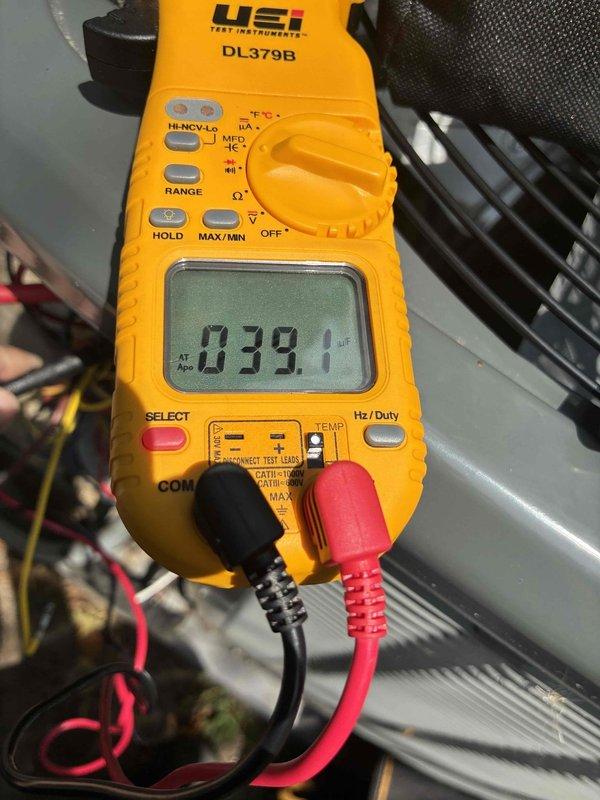 Completed scheduled preventive maintenance on residential cooling system. Performed comprehensive system diagnostics using digital multimeter and clamp meter to verify electrical parameters. Measured voltage at 39.1V and amperage draw at 48.6A to confirm proper compressor and condenser operation. Inspected all electrical connections, tested capacitor function, and verified refrigerant pressures within manufacturer specifications. System operating efficiently with no deficiencies noted.