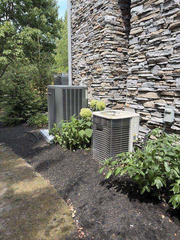 Completed scheduled cooling maintenance on two residential HVAC systems as part of recurring preventive maintenance program. Performed comprehensive inspection and service on indoor furnace unit with integrated cooling coil located in basement mechanical room, including filter evaluation, electrical connections check, and condensate drain line verification. Serviced two outdoor condenser units positioned on exterior pad against stone wall façade, conducting refrigerant pressure checks, cleaning condenser coils, inspecting electrical components, and verifying proper operation of both compressors and fan motors. All systems tested and confirmed operating within manufacturer specifications with no deficiencies noted.