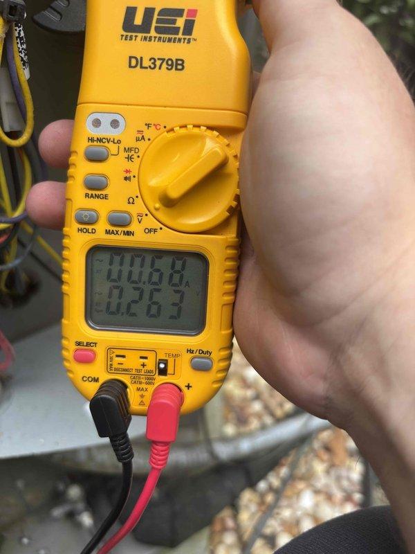 Completed cooling tune-up on residential HVAC system. Performed electrical diagnostics using digital multimeter to verify proper voltage and amperage readings at the capacitor and associated wiring connections. All measurements confirmed system operating within manufacturer specifications, and unit tested successfully under normal cooling operation.