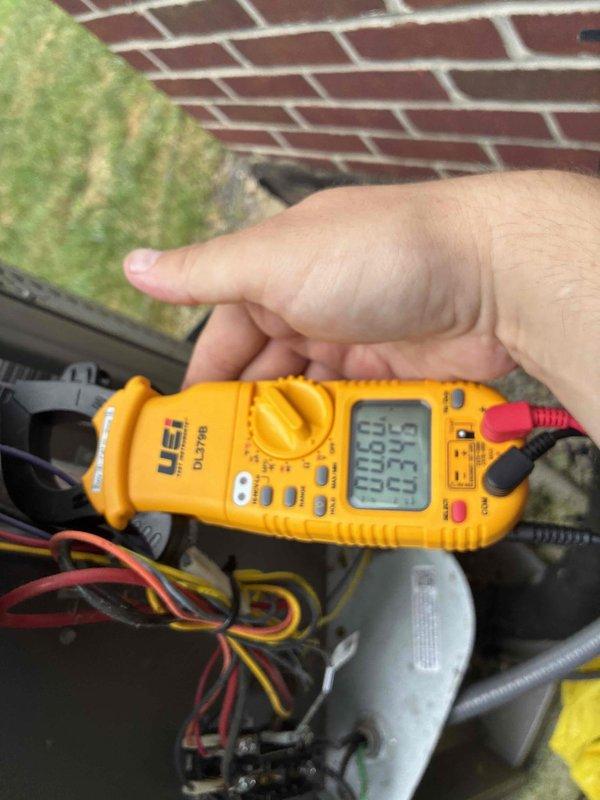 Completed cooling tune-up on residential HVAC system. Performed electrical diagnostics using digital multimeter to verify proper voltage and amperage readings at the capacitor and associated wiring connections. All measurements confirmed system operating within manufacturer specifications, and unit tested successfully under normal cooling operation.