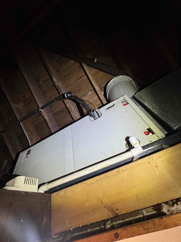 Completed scheduled preventive maintenance on attic-mounted air handler unit as part of ongoing cooling system service plan. Inspected and serviced HVAC equipment including air handler, condensate pump assembly, and associated drainage lines. All components found operating within normal parameters with condensate pump actively functioning and drainage system clear of obstructions.