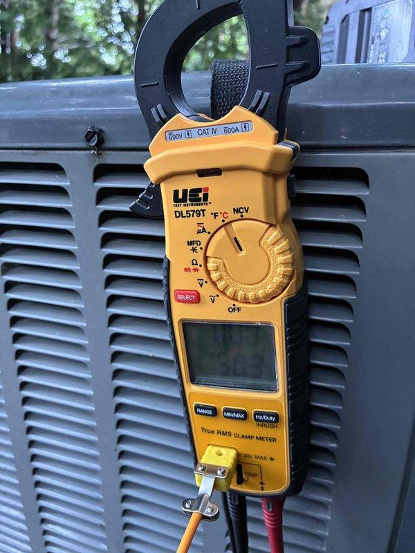 Completed comprehensive cooling season tune-up on residential HVAC system. Performed electrical diagnostics using clamp meter to verify proper amperage draw and system performance. Inspected outdoor condensing unit, noting moderate surface oxidation and staining on ventilation grilles consistent with normal weathering, but unit operational within manufacturer specifications.