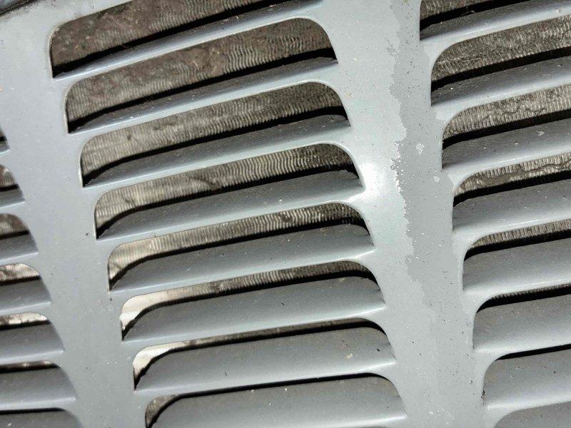 Completed comprehensive cooling season tune-up on residential HVAC system. Performed electrical diagnostics using clamp meter to verify proper amperage draw and system performance. Inspected outdoor condensing unit, noting moderate surface oxidation and staining on ventilation grilles consistent with normal weathering, but unit operational within manufacturer specifications.