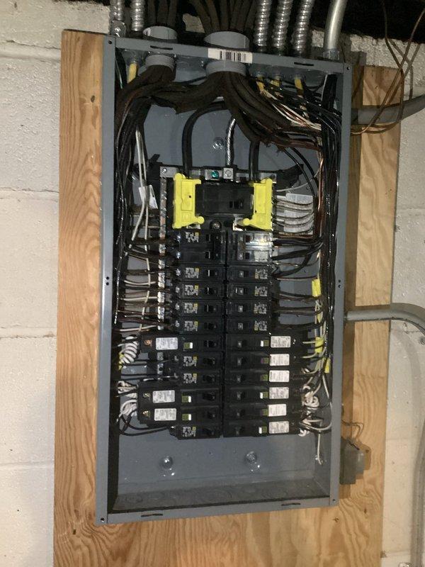 Completed comprehensive electrical inspection of residential property with focus on existing electrical panel and outdated knob-and-tube wiring system. Documented current panel configuration featuring dual-row circuit breaker arrangement with yellow main disconnect switches and assessed overall electrical distribution system condition. Identified safety concerns with existing knob-and-tube wiring and problematic outlet conditions requiring attention. Provided detailed assessment and recommendations for panel upgrade to meet current electrical code requirements and address potential hazards associated with obsolete wiring methods.