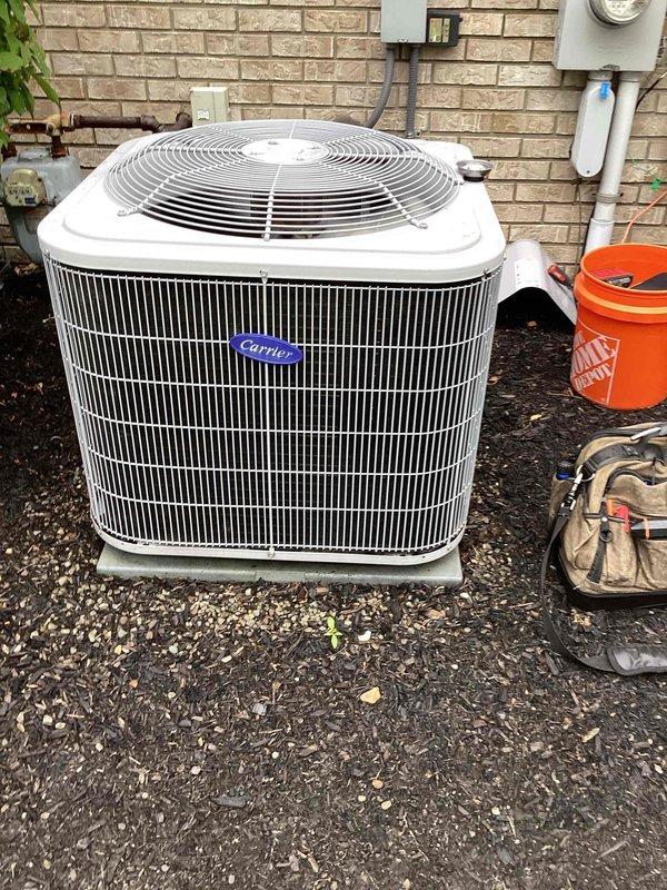 # HVAC Cooling Maintenance Completed

Performed comprehensive seasonal cooling maintenance on Carrier outdoor condensing unit and indoor air handler system. Inspected exterior condenser unit including compressor operation, refrigerant pressures, and electrical connections. Verified proper fan motor operation and examined heat exchanger coil fins for debris or damage. 

Accessed indoor air handler compartment and inspected blower motor assembly and control board. Verified all electrical connections, tested capacitor values, and confirmed proper LED diagnostic indicators on circuit board. Checked all wire harnesses and mounting brackets for secure installation. Conducted dehumidifier maintenance as part of the service visit. All system components operating within manufacturer specifications with no deficiencies noted.