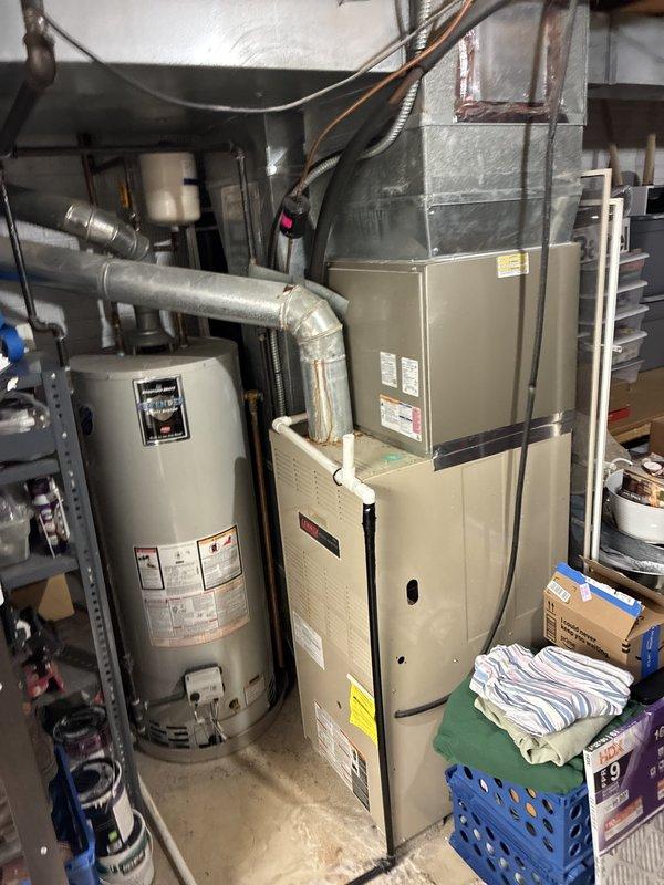 Conducted on-site consultation to provide furnace replacement options for existing residential HVAC system. Evaluated current basement furnace installation, assessed exterior utility connections and electrical infrastructure, documented equipment specifications and spatial requirements, and photographed existing configuration to develop comprehensive replacement recommendations for aging heating system.