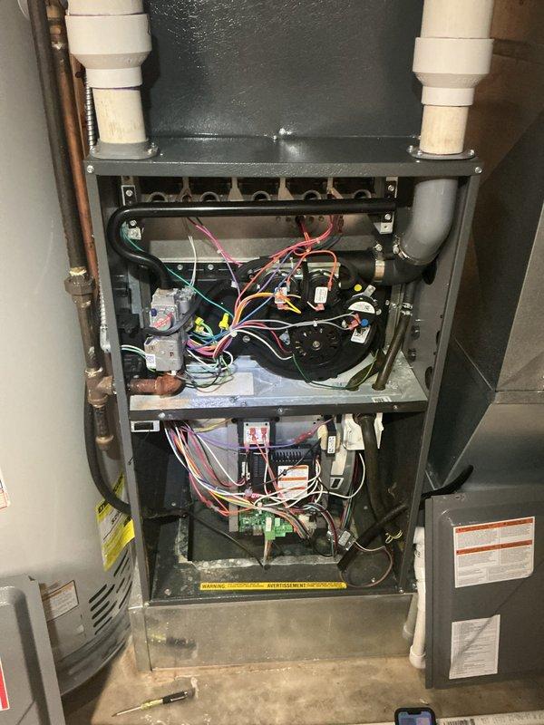 Responded to ongoing water leak issue with Goodman central air conditioning unit, model CAPF4961C6DB. Inspected condensate drainage system and interior furnace components, including PVC drain lines, evaporator coil assembly, and condensate pan for blockages or improper pitch. Verified drain line routing and cleared any obstructions to restore proper water discharge from the system.