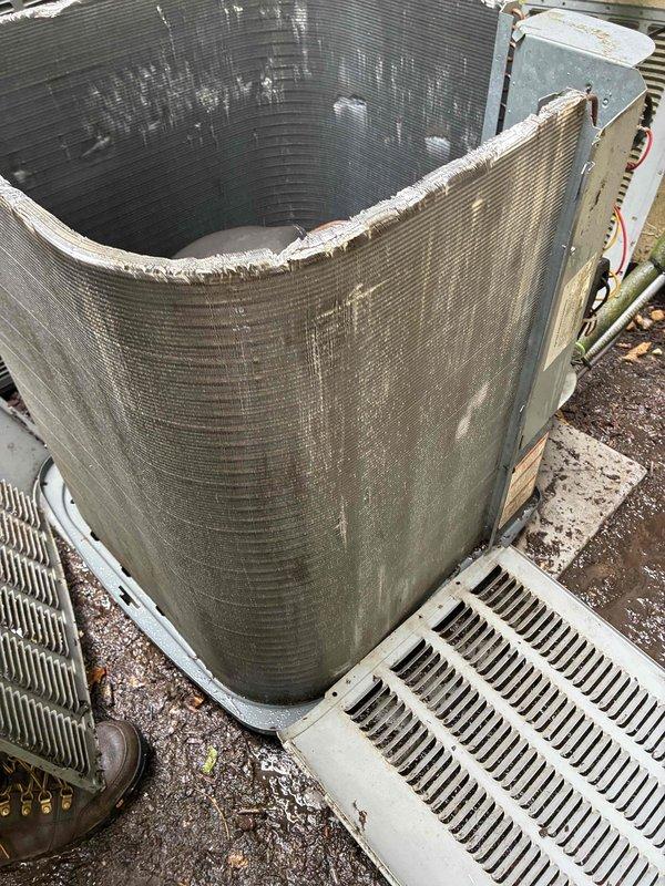 Returned to property to complete condenser unit repairs by installing new condenser fan motor and replacing failed capacitor. Upon arrival, performed thorough coil cleaning to address significant dirt, dust, and debris accumulation that had restricted airflow through the aluminum fin assembly. The condenser coil exhibited heavy contamination with grayish-brown discoloration throughout, along with deteriorated insulation material at the top rim. Completed mechanical repairs, restored proper airflow capacity through comprehensive cleaning, and verified system operation before departure.