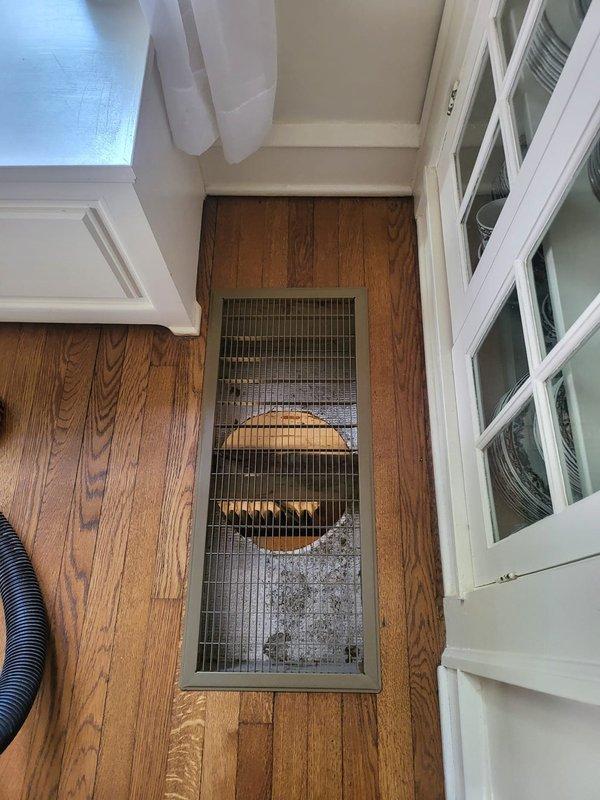 Completed startup and commissioning of Unico air handler system installation. System accessed through floor openings in hallway and kitchen areas, with ductwork routing requiring structural floor modifications to accommodate compact high-velocity distribution system. Verified proper airflow through floor registers, confirmed all connections secure, and validated system operation per manufacturer specifications.